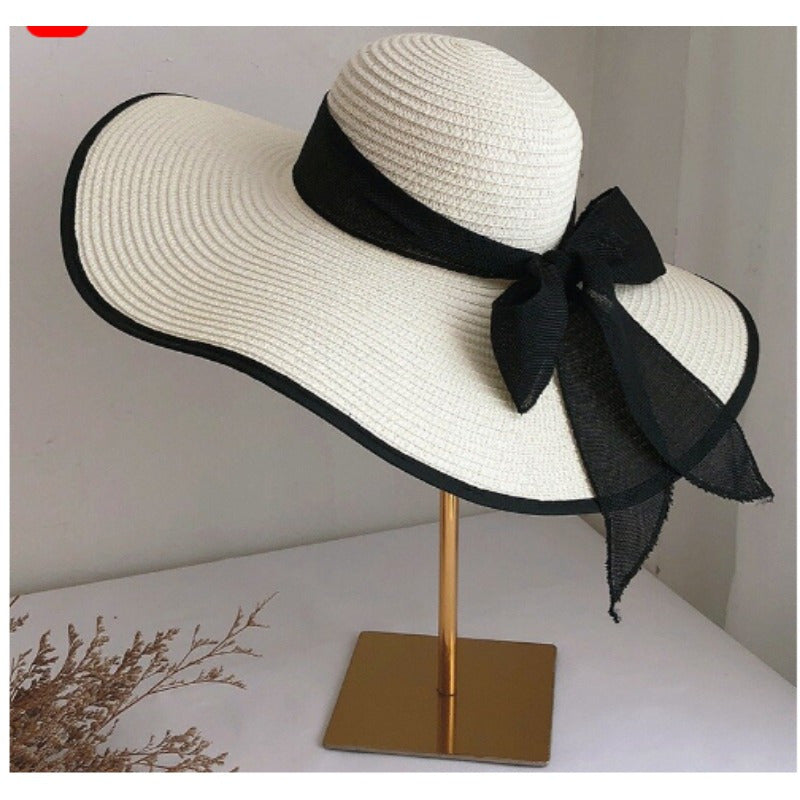 Elegant Women's Straw Sun Hat with Black Ribbon Bow